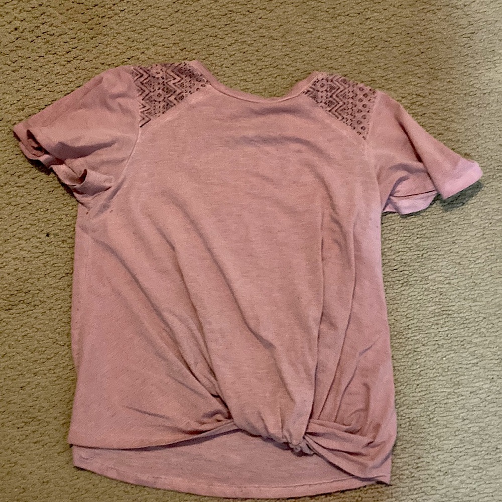 Light magenta T-shirt. Large in kid sizes. The brand is rewind.